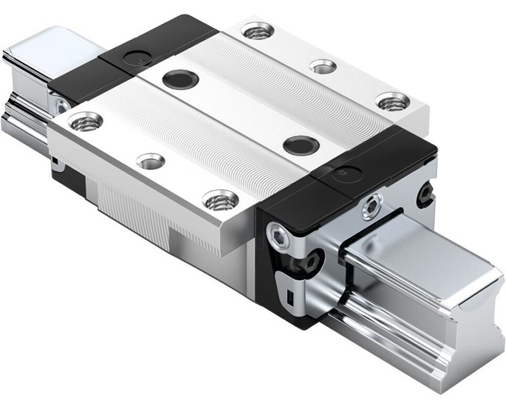 Zdjęcie przedstawia prowadnicę liniową Bosch Rexroth w standardowej konfiguracji, model FNS. Produkt ma charakterystyczny, (kolor, np. srebrzysty, metaliczny) odcień, co sugeruje, że jest wykonany z wysokiej jakości stali.Na obrazie wyraźnie widoczna jest szyna profilowa oraz zamontowany na niej w&oacute;zek prowadzący.Charakterystyka w&oacute;zka:  Typ: Jest to w&oacute;zek z kołnierzem (litera "F"), kt&oacute;ry zapewnia szeroką i stabilną powierzchnię montażową.  Wymiary: W&oacute;zek ma normalną długość (litera "N") oraz standardową wysokość (litera "S"). To sprawia, że jest to najbardziej wszechstronny i powszechnie stosowany wariant.  Detale: Widoczne są otwory montażowe na kołnierzu. W&oacute;zek może posiadać na sobie grawerowane logo Bosch Rexroth oraz oznaczenia techniczne.  Charakterystyka szyny:  Typ: Szyna jest kompatybilna z w&oacute;zkiem FNS.  Konstrukcja: Wzdłuż szyny znajdują się precyzyjnie wyfrezowane tory, w kt&oacute;rych poruszają się kulki, zapewniając płynny ruch.  Montaż: Widać otwory w szynie, przeznaczone do jej mocowania w maszynie.  Zdjęcie może przedstawiać (nowy produkt w opakowaniu/zainstalowaną część maszyny). Prowadnica ta jest podstawowym komponentem, stosowanym w wielu aplikacjach przemysłowych &ndash; od (przykład, np. obrabiarek CNC, maszyn pakujących, urządzeń do robotyki). Jej konstrukcja zapewnia wysoką nośność, precyzję i sztywność, co jest kluczowe dla niezawodnej pracy urządzeń.
