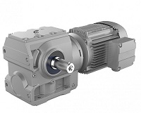 Silniki elektryczne i przekładnie. Kompletne napędy dostępne w DAKAM. Obraz jest ucieleśnieniem kompleksowej oferty w zakresie techniki napędowej. Kompozycja łączy w sobie surową moc i solidność silników elektrycznych z inżynierską precyzją przekładni (reduktorów). Całość jest osadzona w kontekście profesjonalnego polskiego dystrybutora DAKAM, który zapewnia dostępność i wsparcie techniczne. W centrum uwagi, na czystej, industrialnej powierzchni (np. metalowym stole warsztatowym lub białym tle), znajduje się starannie zaaranżowany zestaw, który wizualnie demonstruje kompletne rozwiązania napędowe: • Silnik elektryczny: Solidny, trójfazowy silnik asynchroniczny o standardowym, przemysłowym wyglądzie (np. w kolorze niebieskim lub szarym). Widoczna jest jego masywna obudowa, puszka przyłączeniowa oraz lśniący, stalowy wał. • Przekładnia (Reduktor): Obok silnika leży solidna, samodzielna przekładnia (np. ślimakowa lub walcowa). Widoczne jest jej żeliwne lub aluminiowe korpus, kołnierz przyłączeniowy do silnika oraz wał wyjściowy (lub tuleja), co symbolizuje redukcję prędkości i zwiększenie momentu obrotowego. • Motoreduktor (połączony zestaw): Najważniejszy element – gotowy, zintegrowany motoreduktor, w którym silnik jest już połączony kołnierzowo z przekładnią. To wizualny symbol gotowego do montażu, kompletnego napędu. Tło jest subtelnie rozmyte (efekt bokeh), ale jednoznacznie wskazuje na kompetencje i zaplecze polskiego dystrybutora DAKAM: • Nowoczesny magazyn DAKAM: W tle widać rzędy wysokich regałów magazynowych. Na półkach wyraźnie widać oryginalne opakowania (kartony) oraz zapas silników i przekładni czołowych marek (np. Bonfiglioli, Motovario, Siemens). Duża ilość towaru na stanie wizualnie potwierdza status "sprawdzonego dystrybutora". • Logo Dystrybutora: W dyskretnym, ale widocznym miejscu umieszczone jest logo DAKAM, z dopiskiem "Centrum Techniki Napędowej" lub "Autoryzowany Dystrybutor". Obraz niesie jasny komunikat: "Jako sprawdzony polski dystrybutor DAKAM, posiadamy na stanie pełen asortyment silników elektrycznych, przekładni oraz gotowych motoreduktorów od najlepszych producentów, dostępnych natychmiast z naszego magazynu".